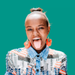 A young African woman, skilled in web development and design in Kenya, playfully sticks her tongue out.